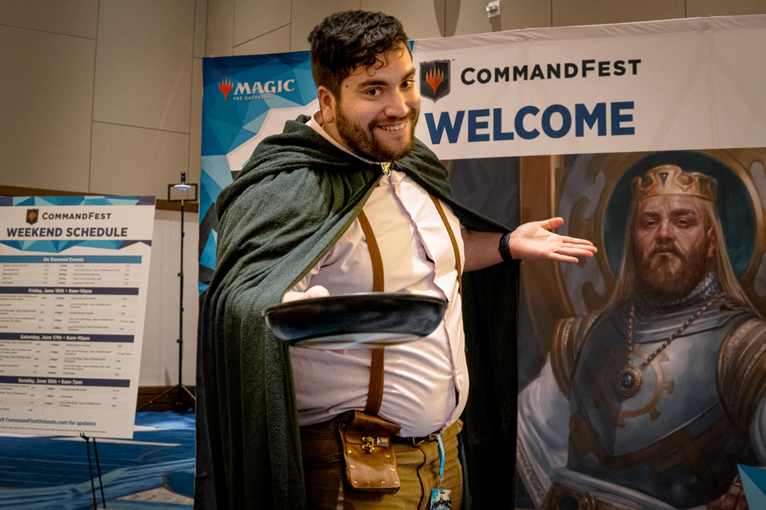 Player cosplaying as a hobbit offering a plate of food