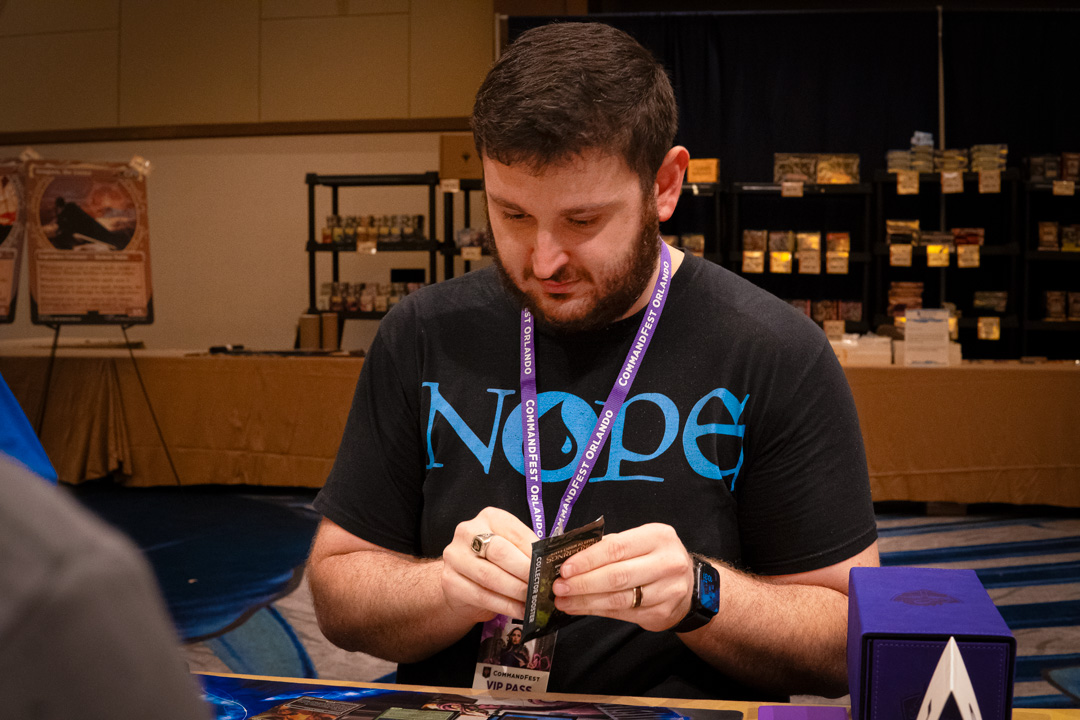 Guy wearing a shirt that reads "NOPE" playing MTG