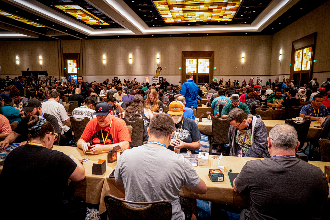 Wide shot of the gaming room filled with people